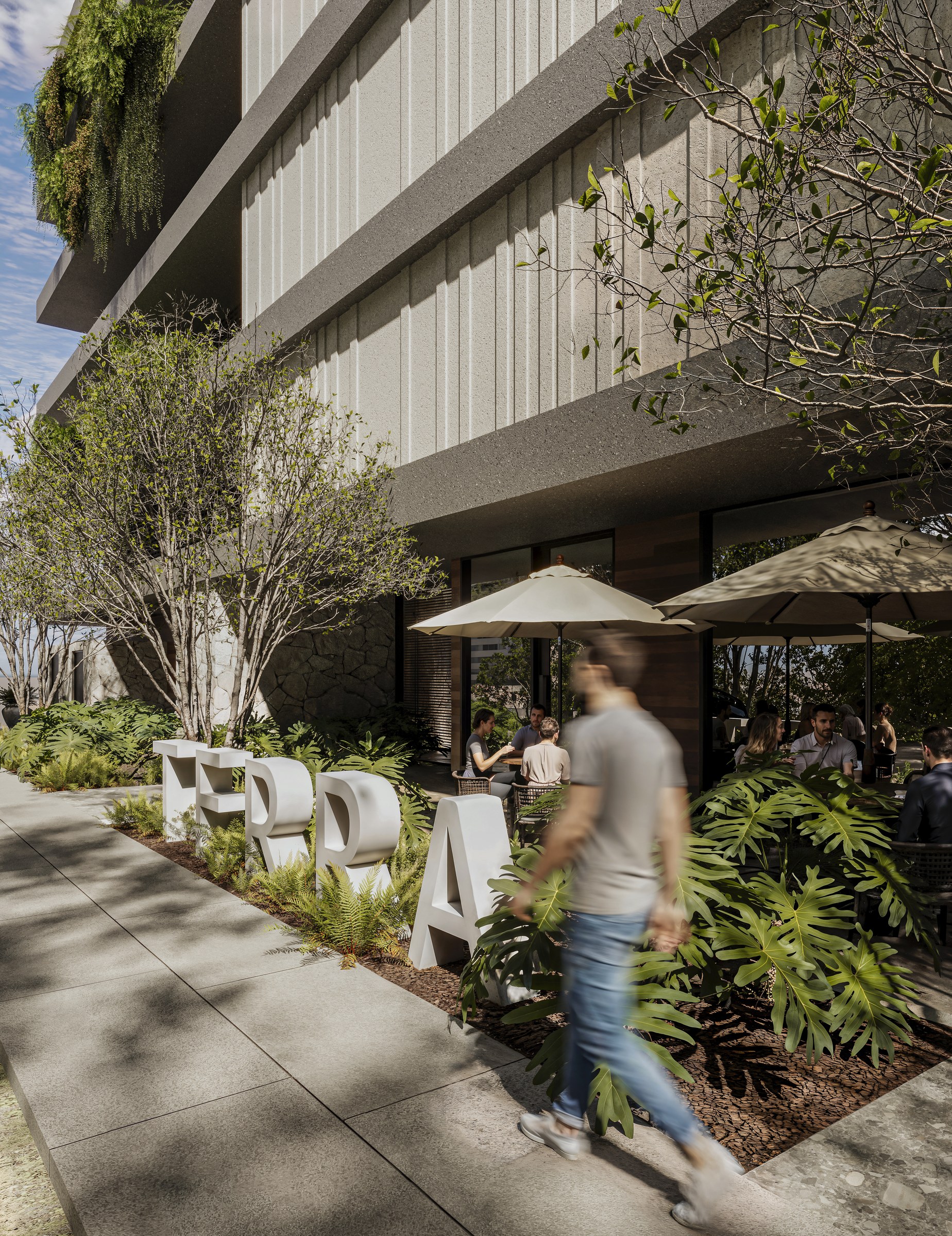 Terra Tower — embasamento com o letreiro TERRA e paisagismo