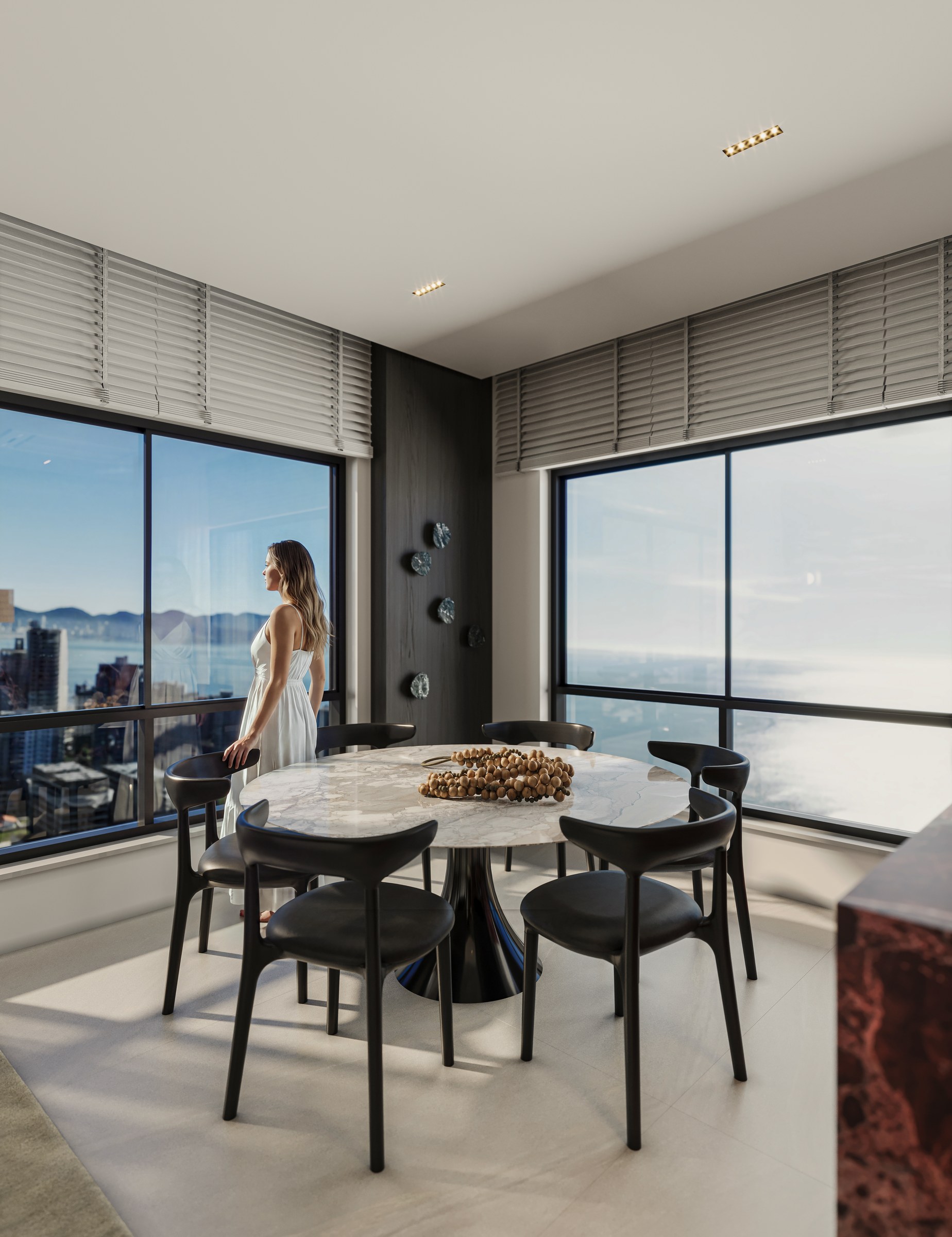 Terra Tower — mesa de jantar junto às esquadrias com vista mar