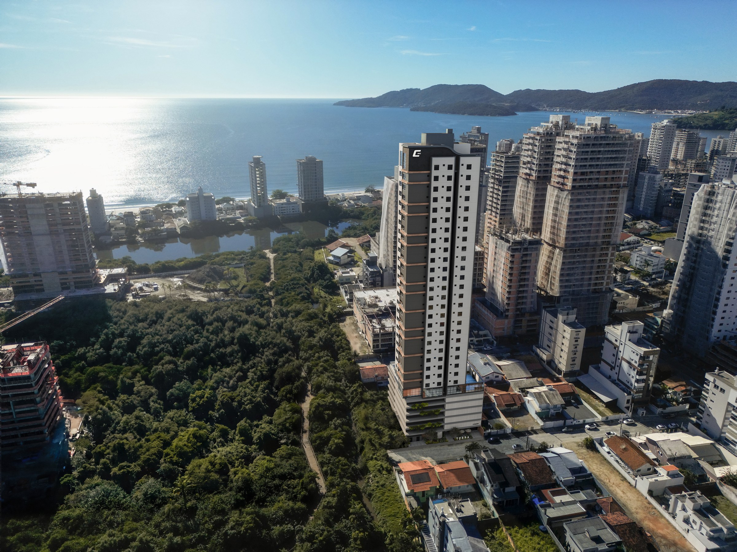 Terra Tower — vista aérea com a área verde do Parque da Lagoa e o mar de Balneário Perequê